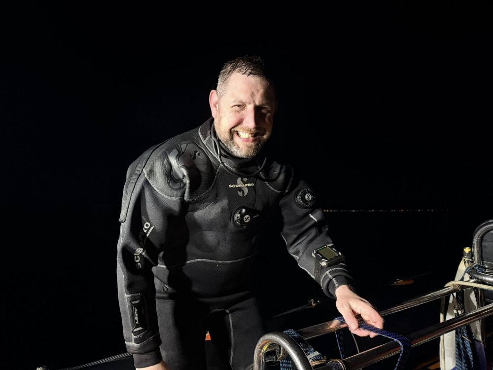 Enda with a smile on a night dive